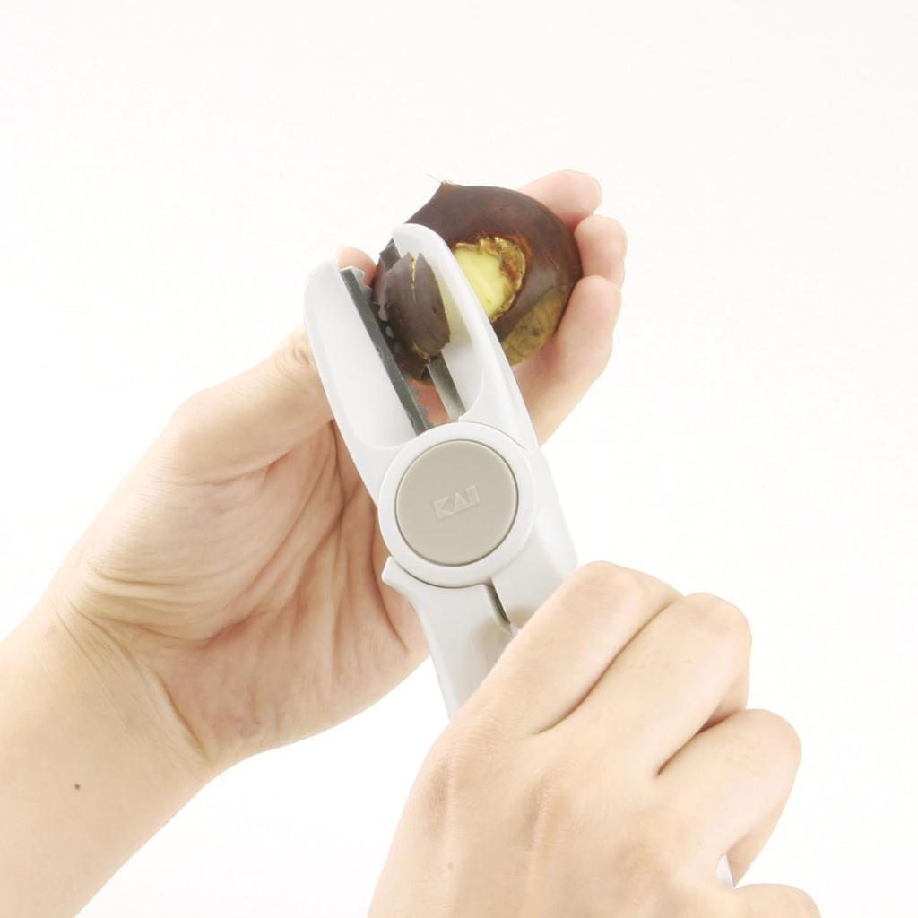 KAI Chestnut Cutter Removes raw and boiled chestnut skins and has a convenient cap for Made in - storage. Japan. DH8183.