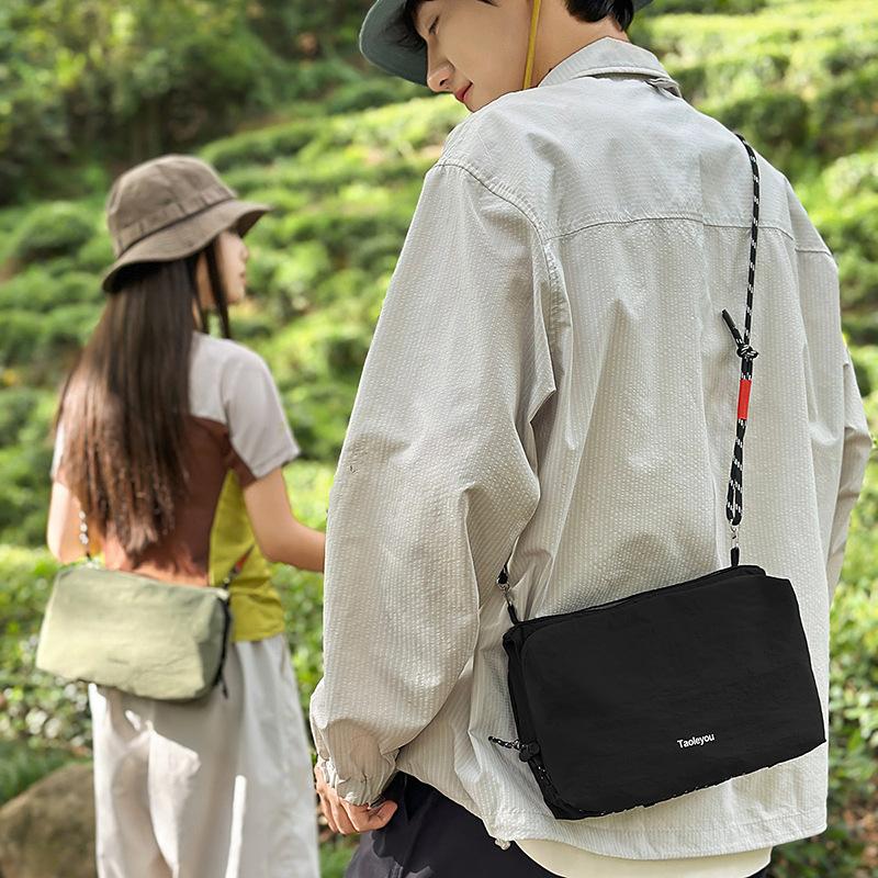 Mountain outdoor leisure messenger bag men's tide brand lightweight waterproof shoulder bag large capacity commuter backpack women's mobile phone bag