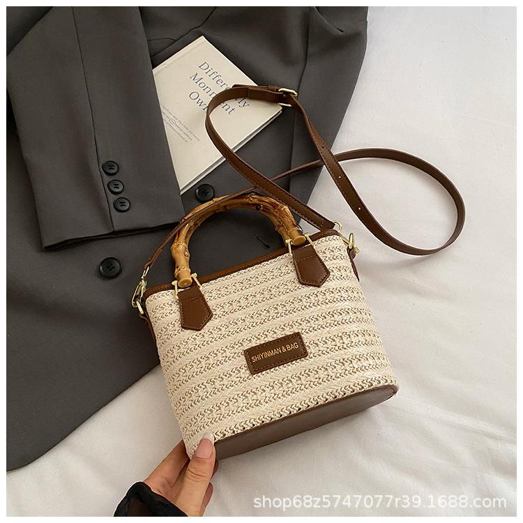 Summer hand bag small bucket bag women's 2025 new simple high-end shoulder bag niche messenger straw bag