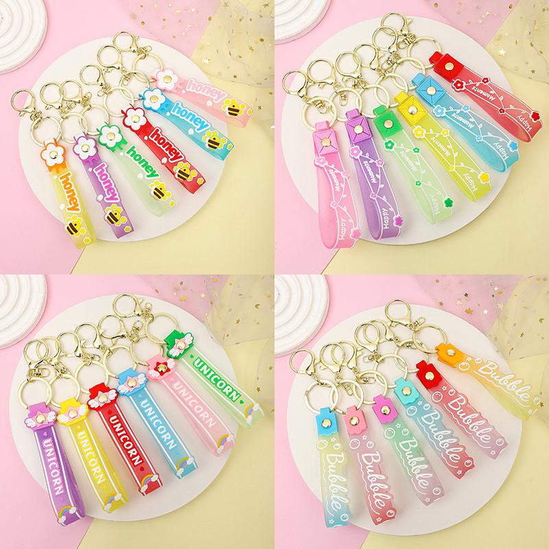 Transparent Pvc Soft Rubber Rope Keychain English Small Flower Jelly Color Plum Blossom Candy Color Drop Adhesive Wristband