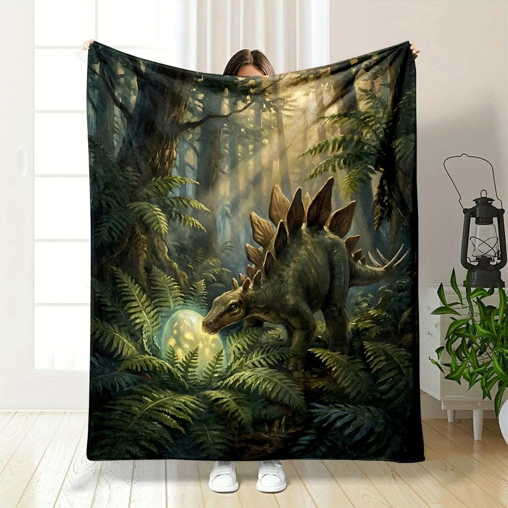 A Stegosaurus In a Lush Forest Examines a Glowing Egg Among Ferns. for All Seasons Blanket Lunch Break Throw Gift