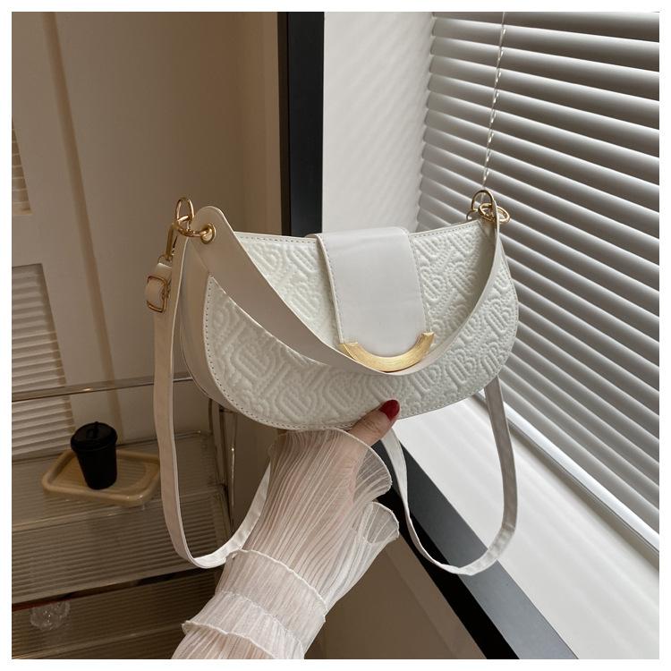 

French niche saddle bag women s bag 2024 new indentation embroidery thread candy color underarm bag fashion shoulder handbag білий