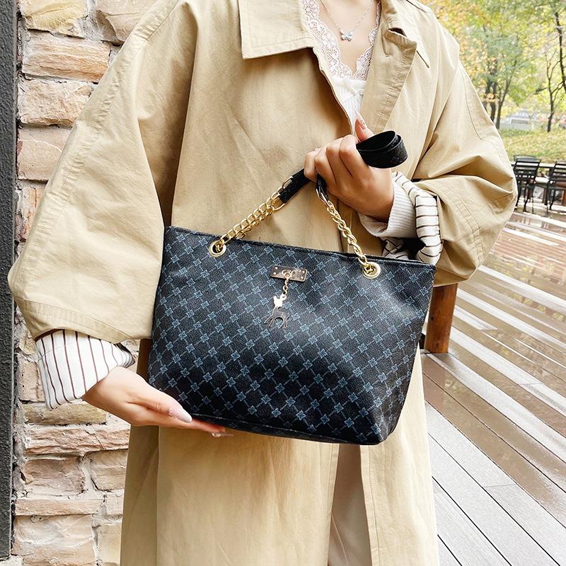 Damentasche neu retro Nische tragbar Persönlichkeit trendig große Kapazität Mode Pendler Schultertasche Tragetasche