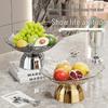 Transparente Obst- und Snack-Präsentationsplatte mit hohem Fuß: Modernes Licht-Luxus-Design für Wohnzimmer-Couchtische.