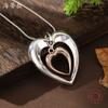 New hollow two-color love snake bone chain pendant, women's fashion high-end glossy heart-shaped neck chain