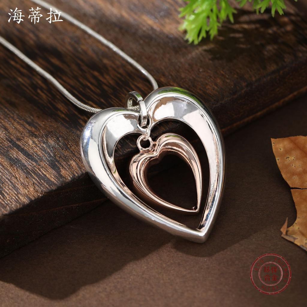 New hollow two-color love snake bone chain pendant, women's fashion high-end glossy heart-shaped neck chain