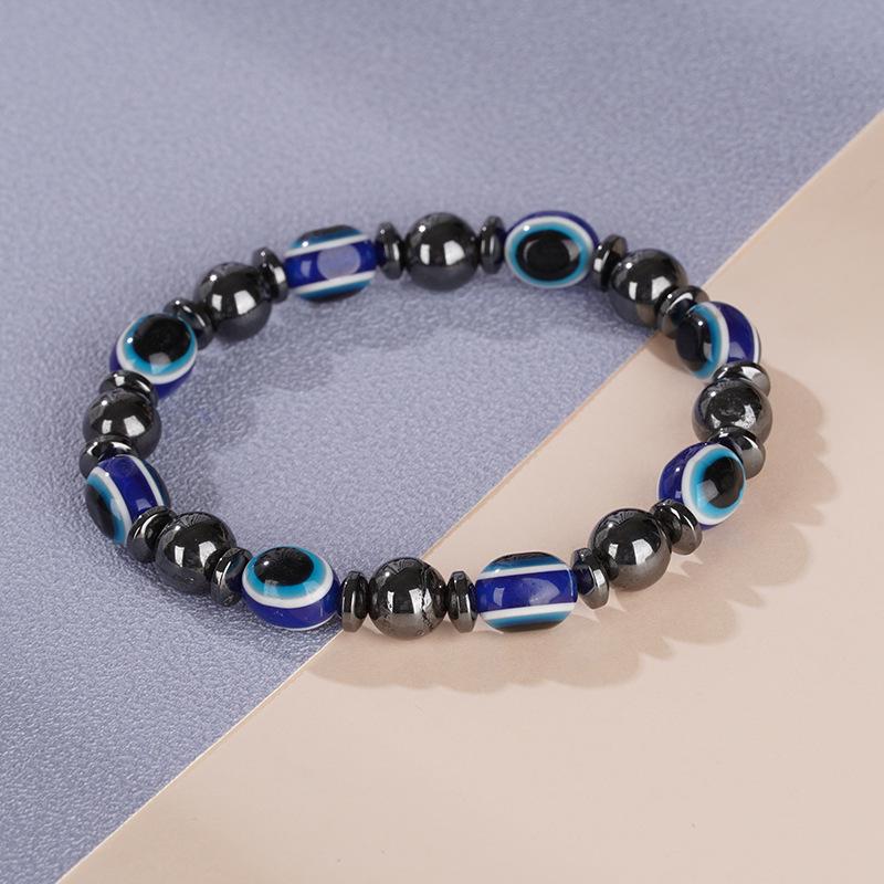 

2023 European & American Black Gallstone Elastic Couple Bracelet with Blue Eye Beads