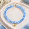Adjustable Beaded Pendant Necklace with Rounded Resin Beads, Heart-Shaped Center Pendant, Extension Chain, and Lobster Clasp