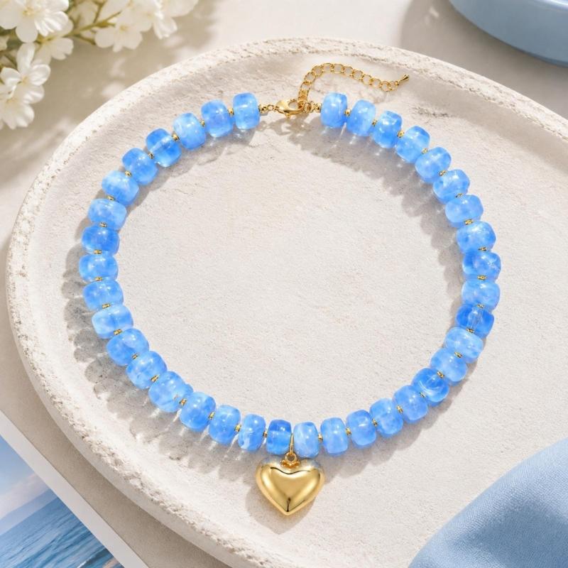 Adjustable Beaded Pendant Necklace with Rounded Resin Beads, Heart-Shaped Center Pendant, Extension Chain, and Lobster Clasp