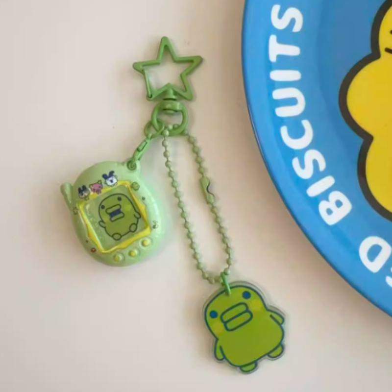 

Cartoon Tamagotchi Charms Mametchi Lovelin Kuhcipatchi Cute Pendant Keychain Bag Charm Collectible Decoration Kid Birthday Gifts