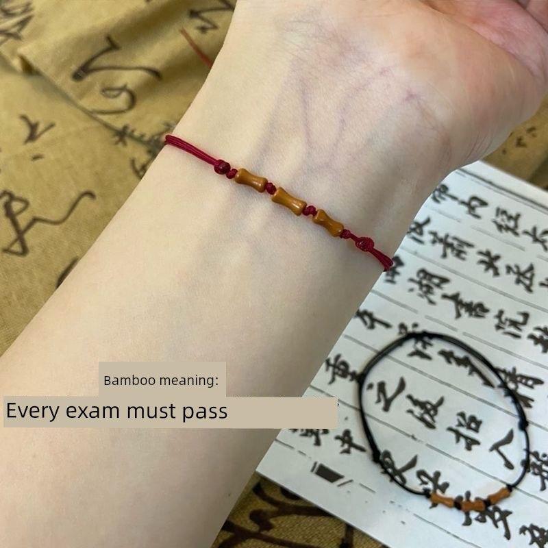 

Xiaohongshu Тот же стиль Продвижение фестиваля бамбука Ремешок для переноски Плетеная красная веревка из косточки оливы Запястье Подарок для лучшей подруги Экзамен Выпускной [1] red rope