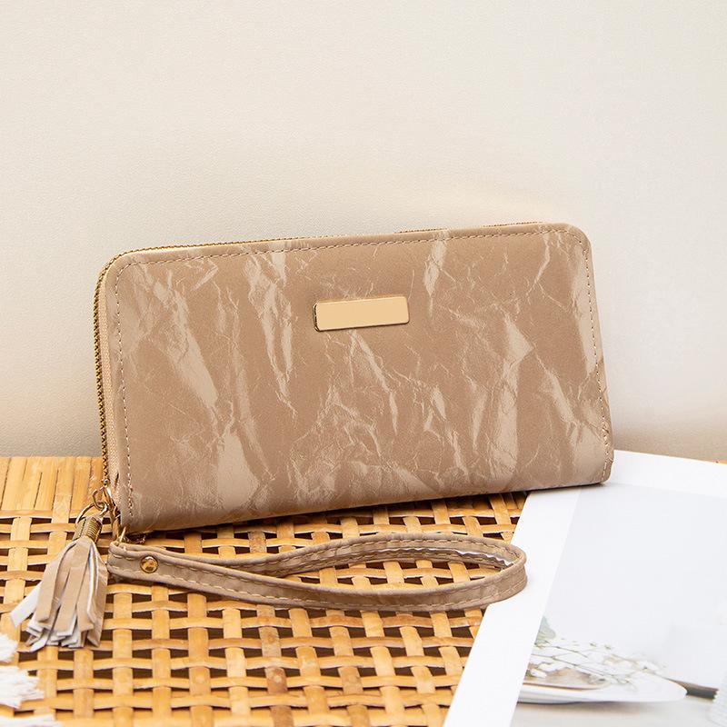 Spring and summer new simple multi-card position hand-held women's bag, fringed zipper, long wallet, and a wallet.