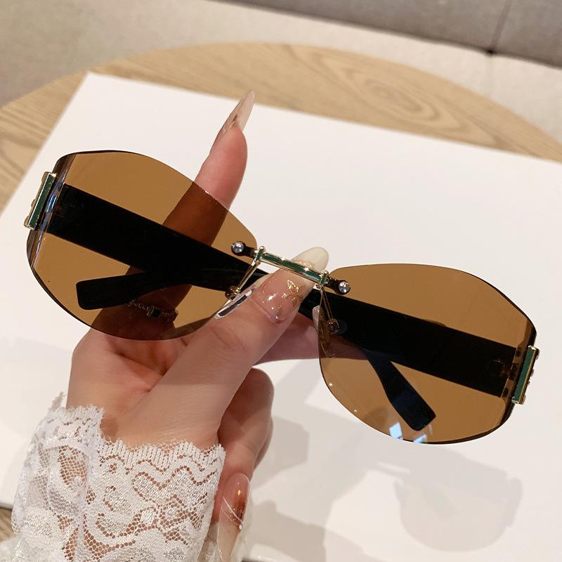 Women's Retro Frameless Oval Curved Lens Sunglasses Metal Sunglasses