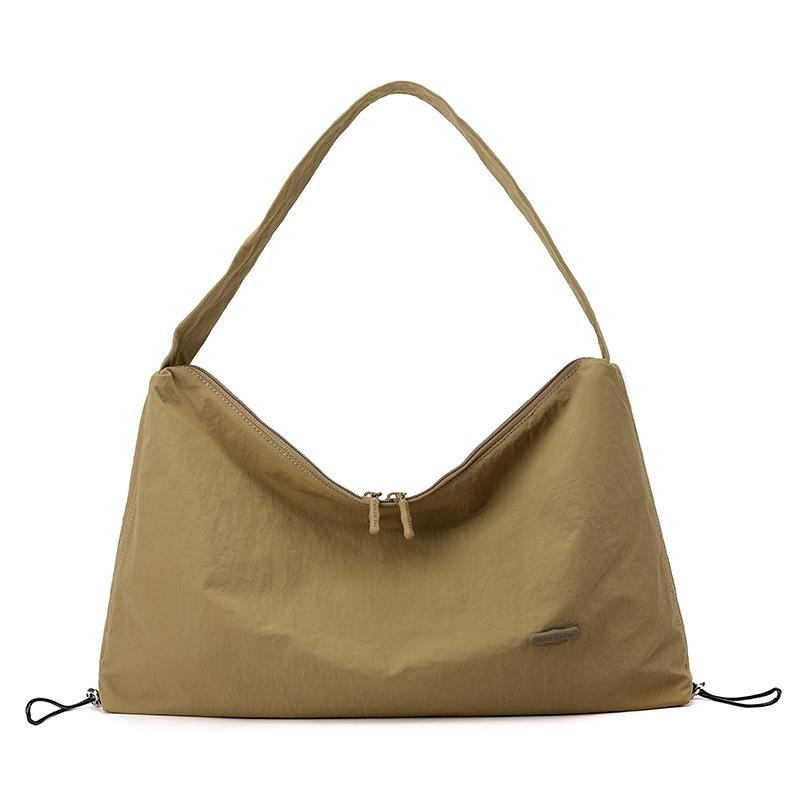 Korean style spring and summer new women's solid color high-end niche shoulder crossbody armpit bag