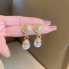 European and American metal wind hollow flower fishtail pearl earrings exaggerated temperament earrings heavy industry earrings