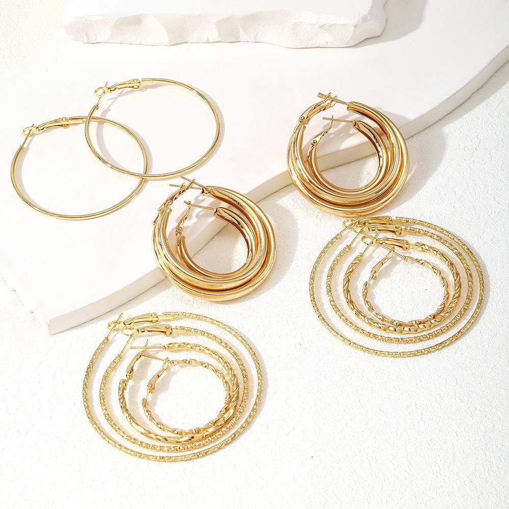 Hot-selling gold ear buckles, stacked wearing large round earrings, beating pattern twist popular popular circle earrings 1-piece set