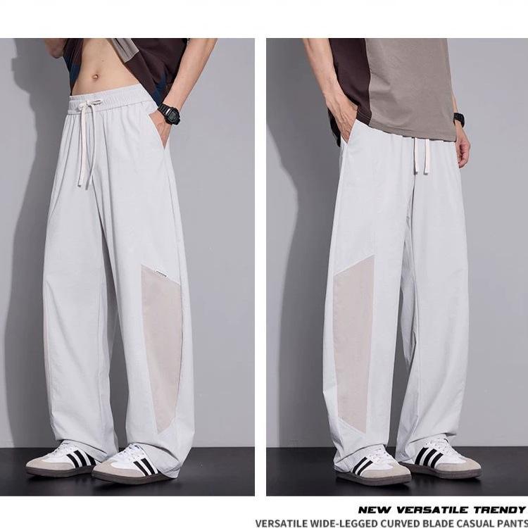 Spring and summer new scimitar loose straight ice silk contrasting color splicing black casual pants men's very light pants