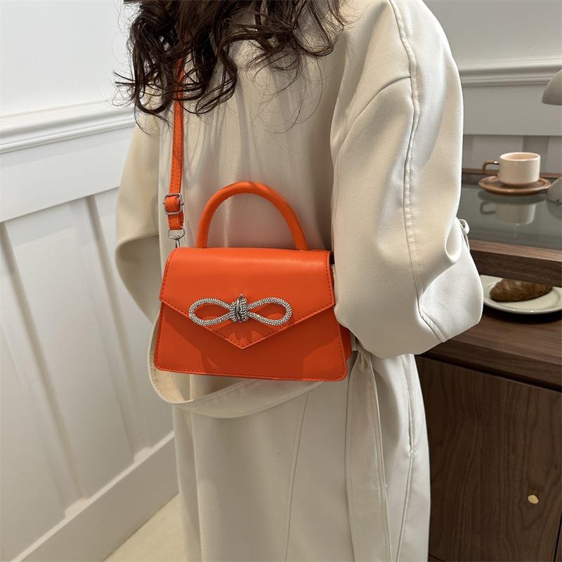 Simple and popular versatile solid color bow sewing line women's bag fashionable oblique span shoulder handbag