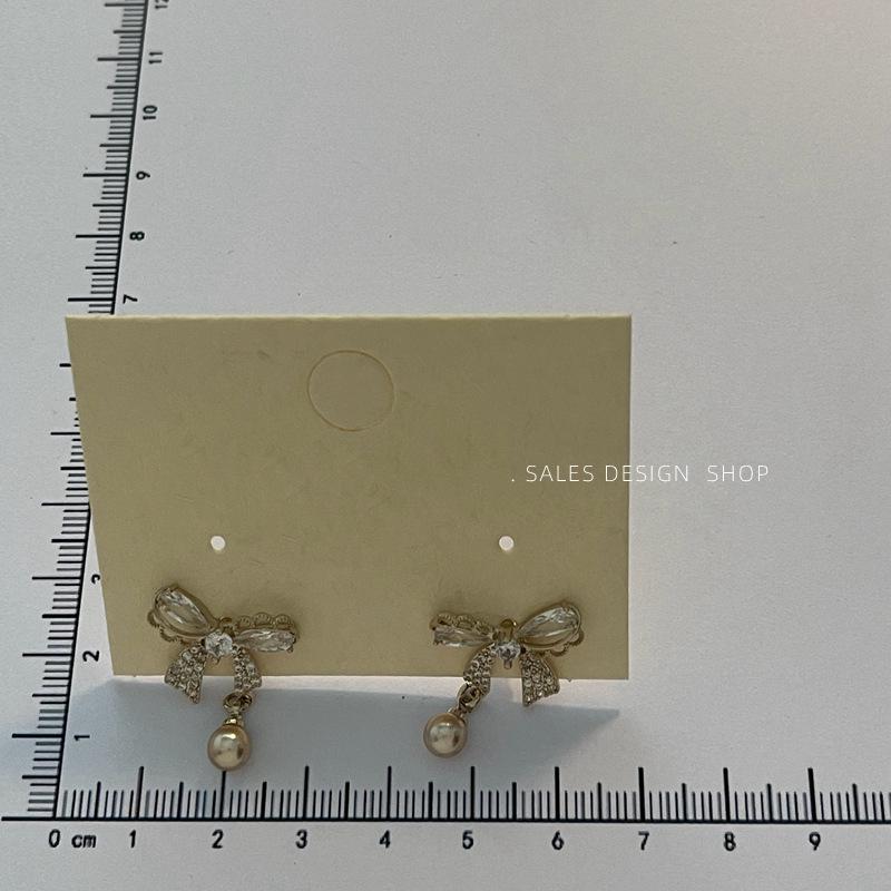 Korean Zircon Bow Pearl Stud Earrings - High-End, Versatile & Elegant.