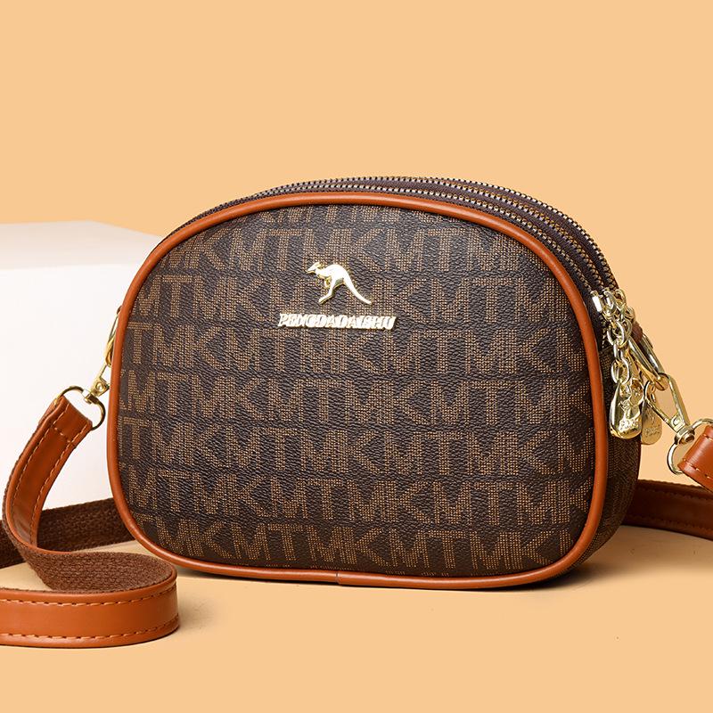 

Женская модная сумка-кроссбоди круглой формы с принтом | Новый стиль 2025 | Повседневная универсальная сумка-цилиндр 21*7*16 cm коричневый