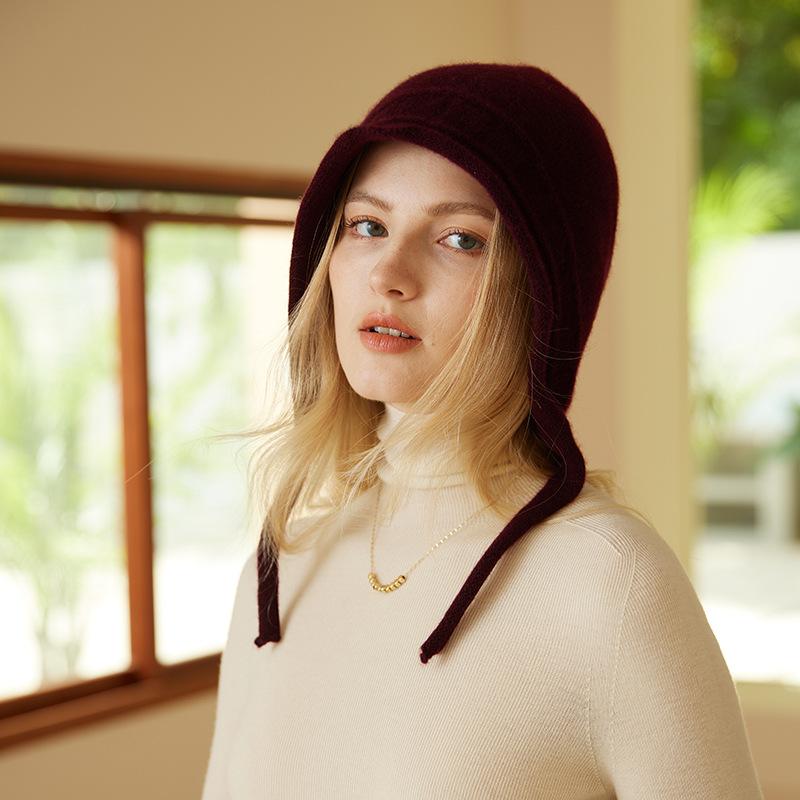A New Autumn and Winter Style Women's Knitted Cap with A Solid Color Warm and Ear Protecting Edge  Featuring A Rolled Up Jacquard Strap