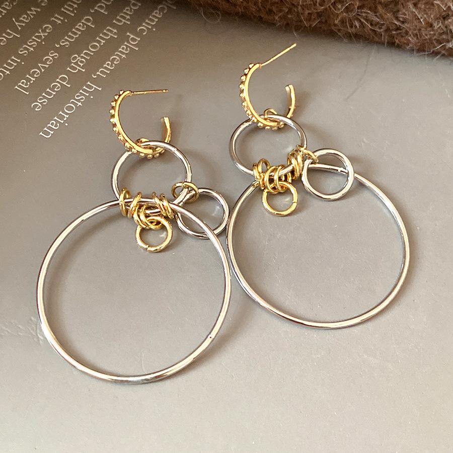 

Silver needle hollow round pendant earrings European and American cold wind temperament earrings light luxury high-end earrings