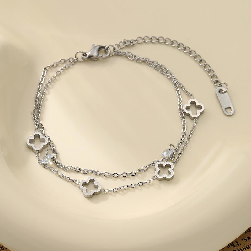 

Браслет из титановой стали с полым четырехлистным клевером, двойной, не теряет цвет, украшение для девушек и подруг, простой браслет