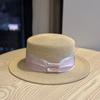 Spring and Summer French Retro Flat-top Straw Hat Women's Woven Sun Hat Wide-brimmed Ribbon Metal Label Seaside Vacation Sun Protection Hat