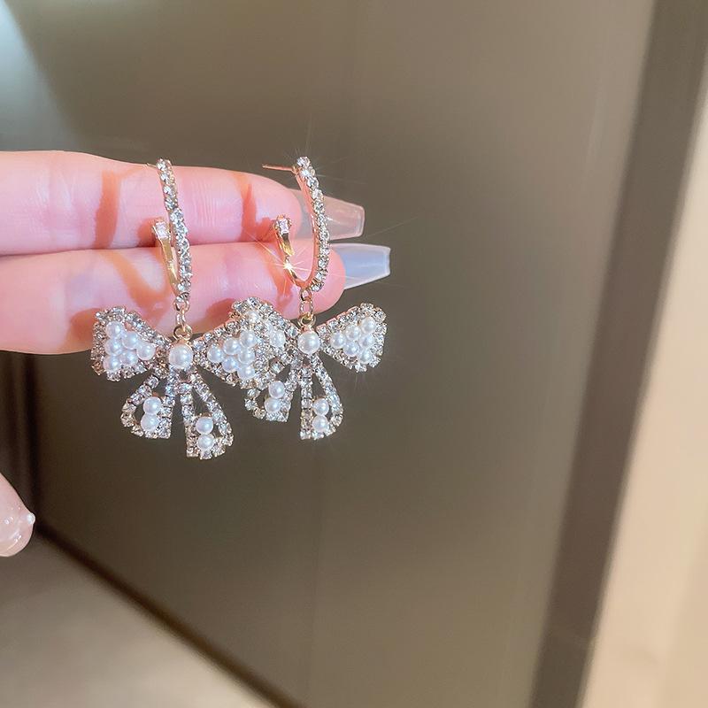 Silver needle diamond bow pearl earrings French light luxury high-end earrings female personality Internet celebrity style earrings wholesale