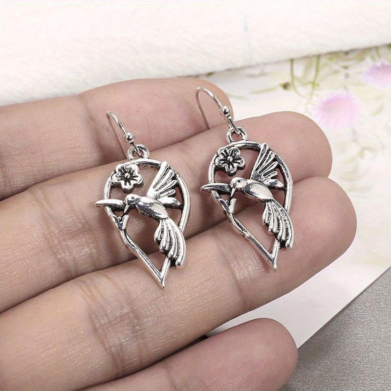 

A Pair of Street Fashion, Cool and Hip-hop Style Flower Pendant Bird Multi-functional Earrings