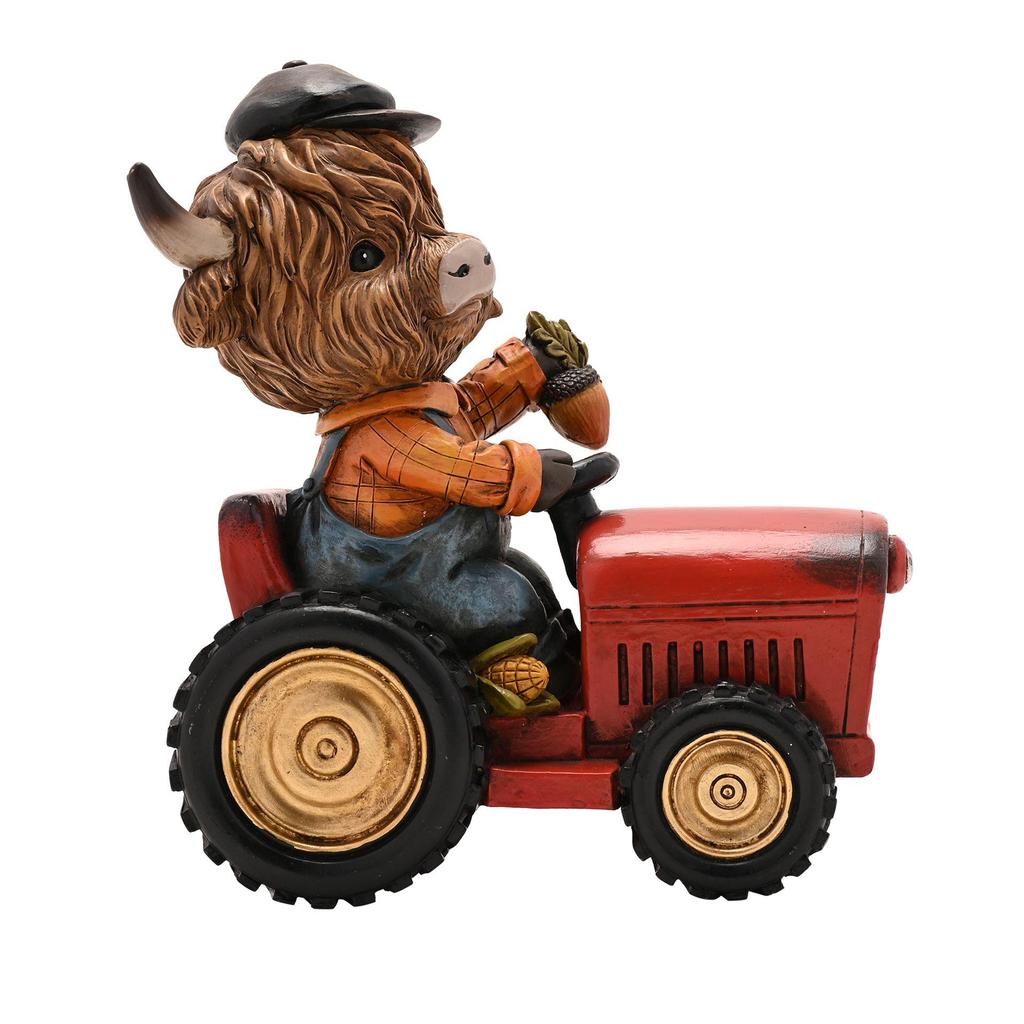 Country Living Highland Cow on Tractor