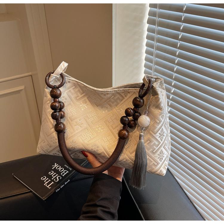 

Модная тканевая сумка женская 2025 весна и лето новая нишевая портативная сумка-тоут высокого класса на плечо под мышку фиолетовый