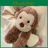 Peluche scimmia sorridente carino con materiale in peluche corto per la stanza dei giochi dei bambini