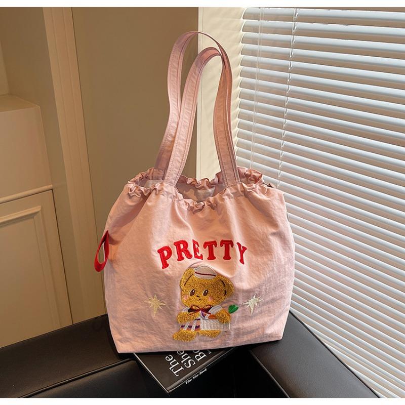 The new School of Arts and Art style is simple and large-capacity tote bag, and women's tide is popular. Versatile commuter shoulder bag.