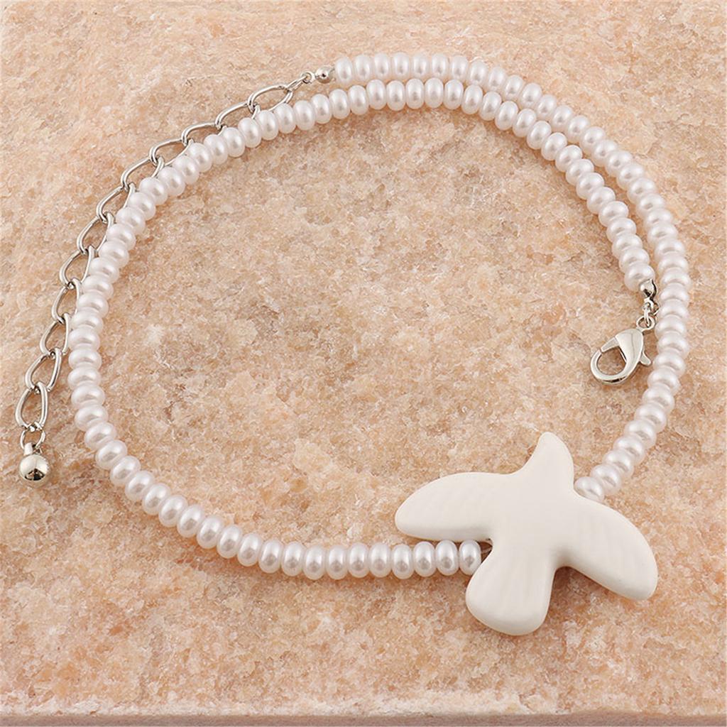 Multifunktionale lange Pulloverkette mit weißem Friedenstauben-Anhänger, modische Anhänger-Ohrringe für stilvolles Alltagsoutfit