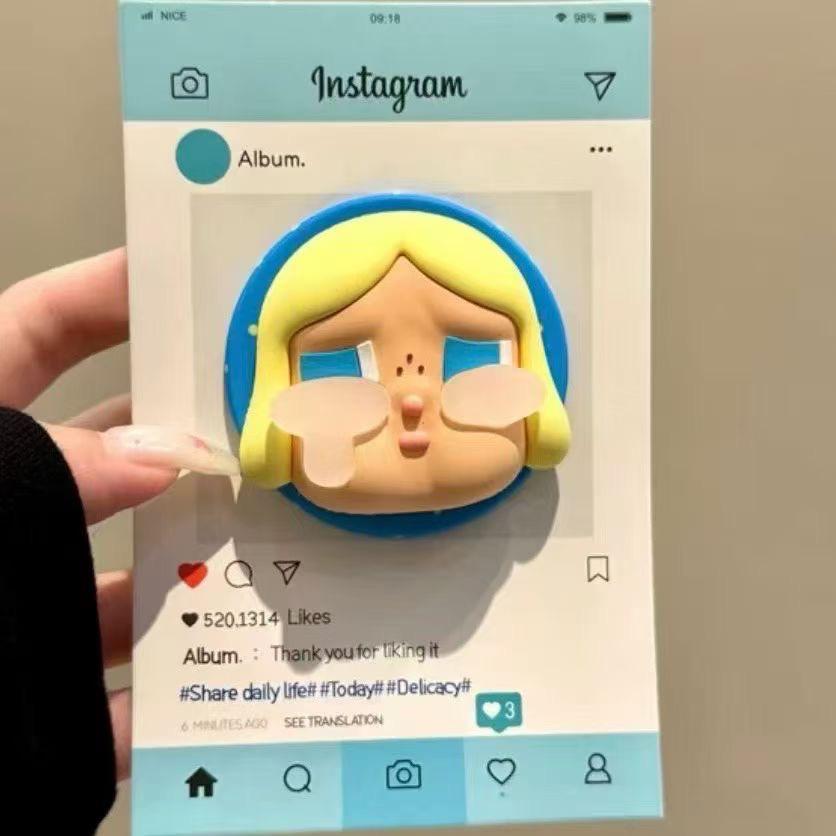3D Silicone Star Crying Doll with MagSafe Magnetic Mount, Telescopic Airbag, and Strong Desktop Adhesion OPP Bag Packaging
