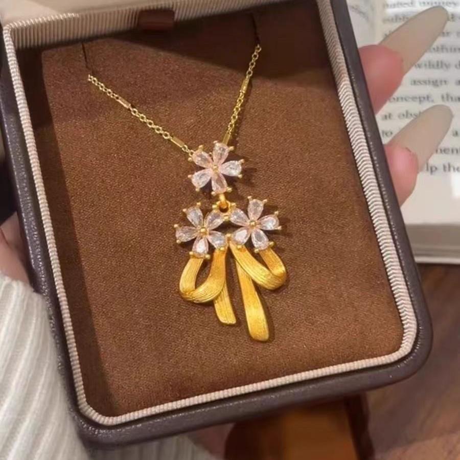 New Chinese bow flower pendant fringed necklace women's gold high-end temperament niche design accessories