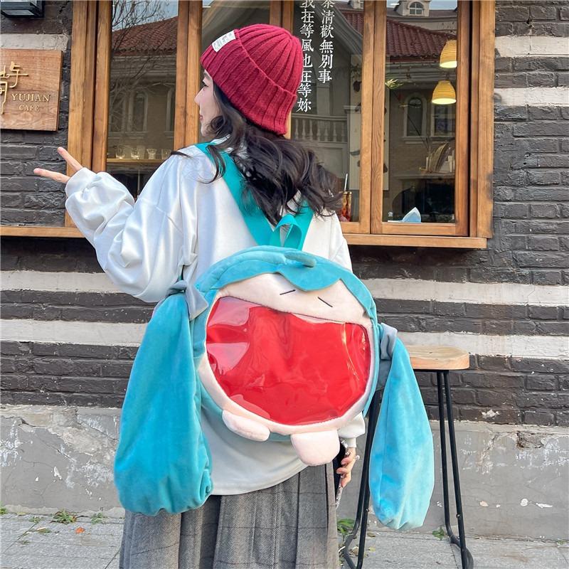 Cute girl two-dimensional green big-eared girl backpack doll backpack student transparent bag