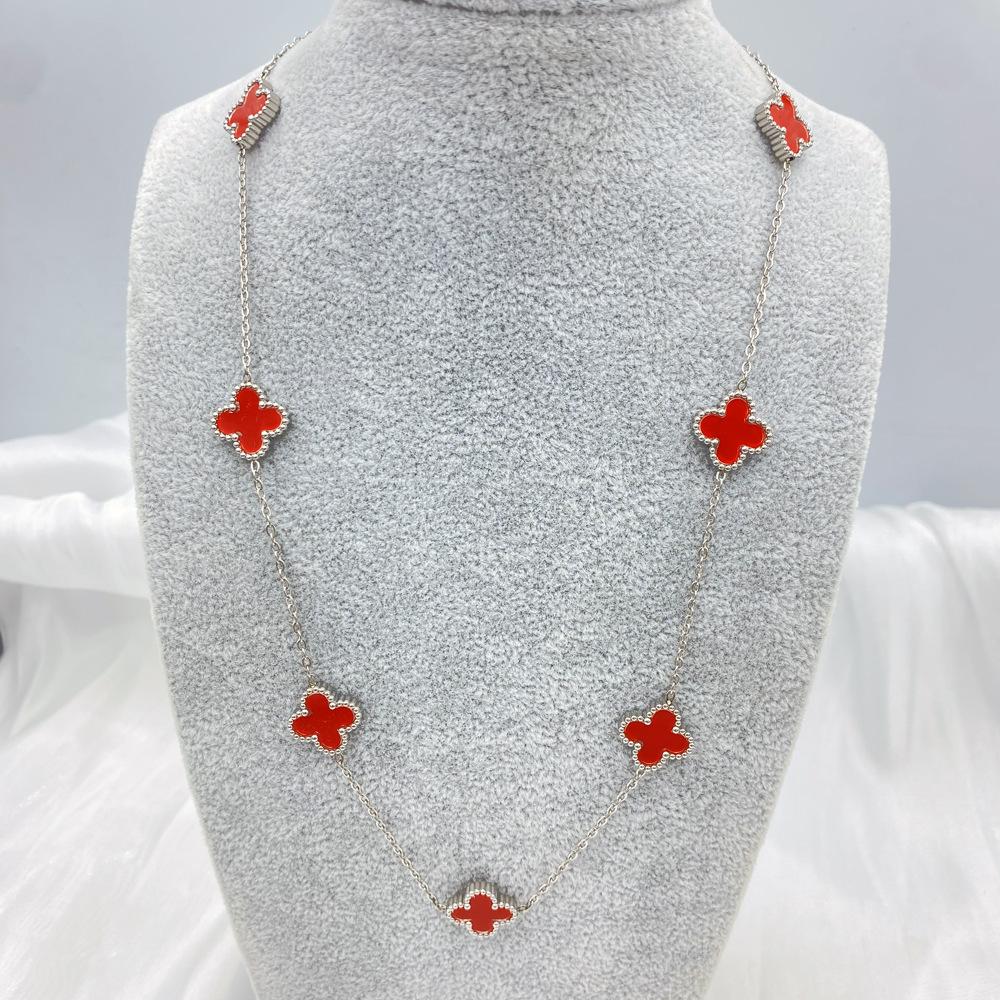 Collier de fleurs de trèfle à quatre feuilles pour la mode féminine, tempérament de luxe léger, chaîne de pull haut de gamme à sept fleurs