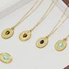 Retro Turquoise Inlaid Stainless Steel Necklace with Embossed Round Pendant for Women