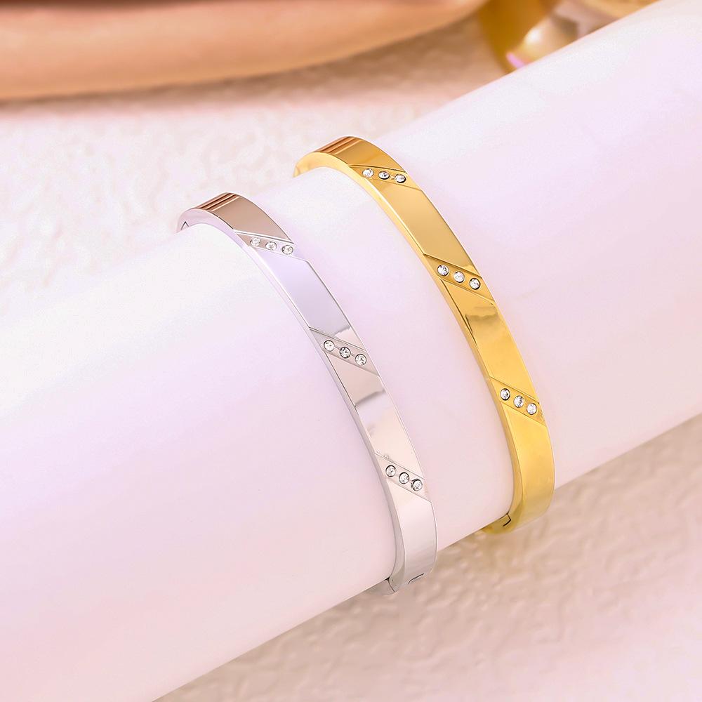 European & American Luxury 18K Gold Titanium Steel Bracelet with Three Diamonds & Non-Fading Buckle for Women.