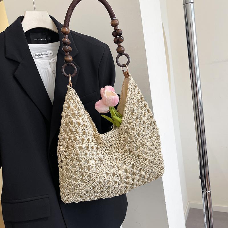 Summer fashion bag women 2025 new seaside beach hollow shoulder bag portable woven tote bag