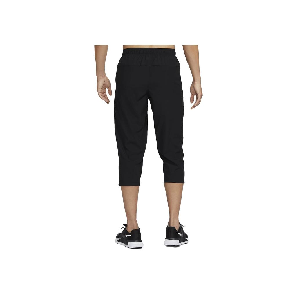 Nike Dri-FIT Pánské jednobarevné rychleschnoucí zúžené tréninkové capri kalhoty Černá FB7503-010