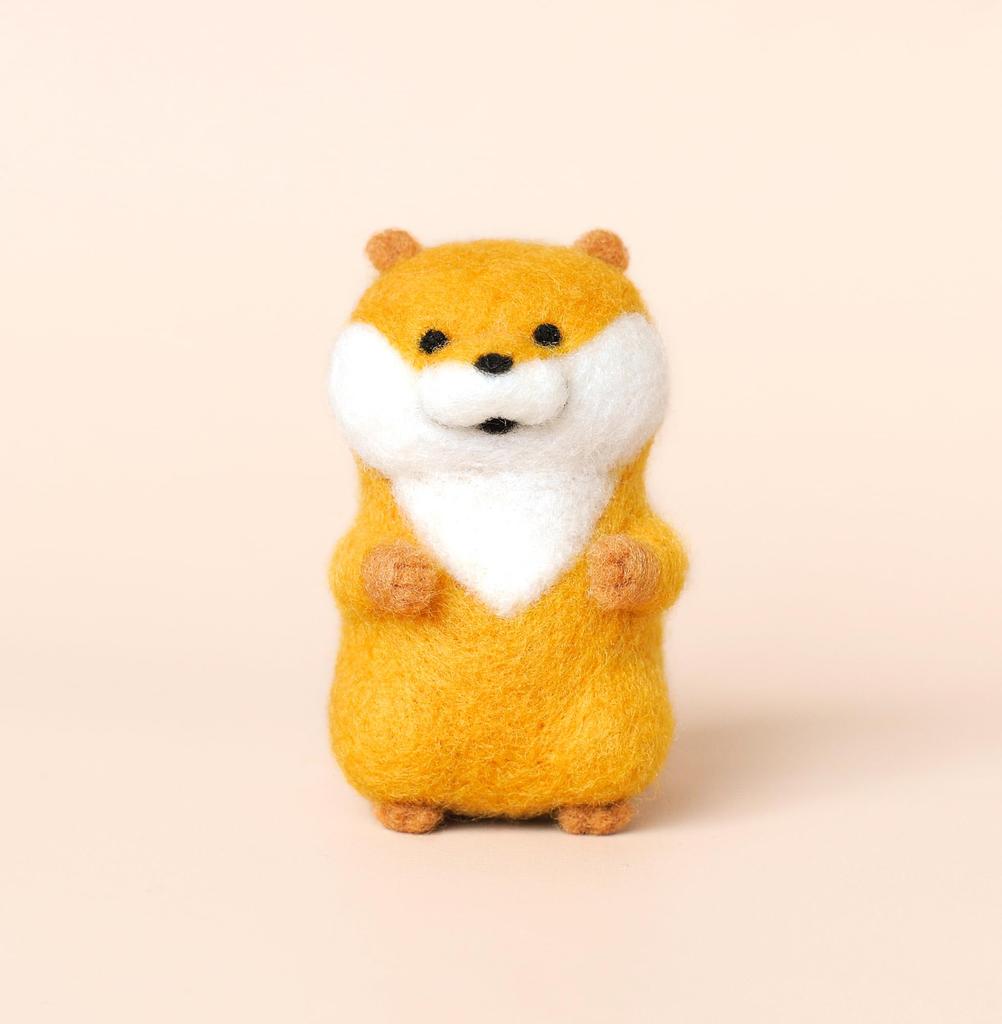 A lying otter made with needle felting cute,