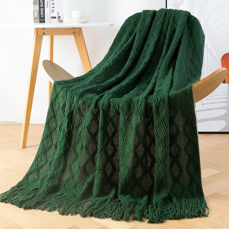 Orange knitted throw blanket for model homes, suitable for use as a sofa or bed throw, for furniture stores and home showrooms as a soft decoration