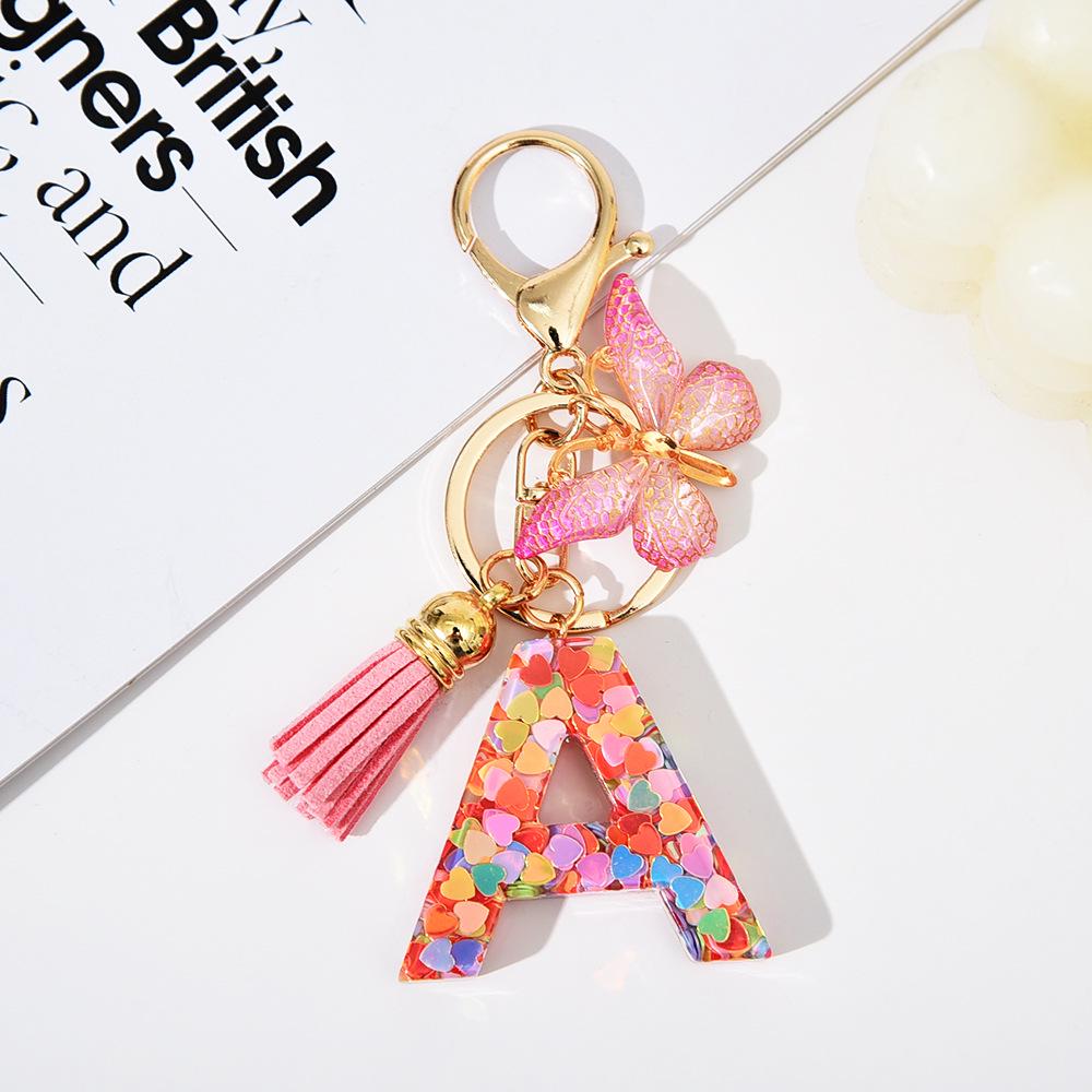 

Трансграничный брелок-кисточка в виде сердца и бабочки с 26 пайетками в виде букв алфавита