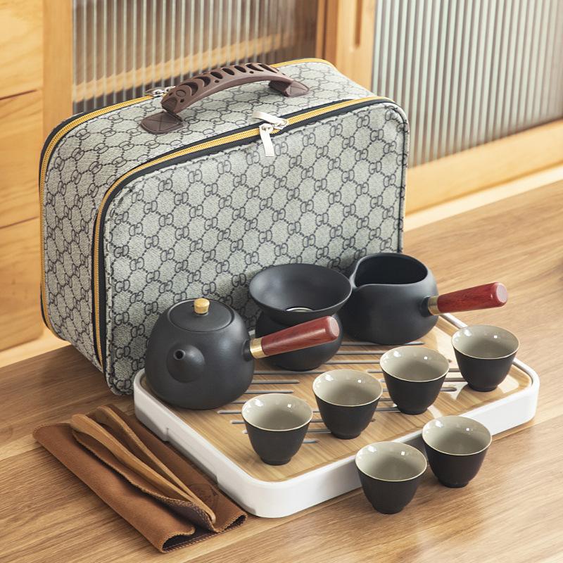 Black pottery Kung Fu tea set, cheap ceramic side handle pot with tea tray, portable complete set of business gifts