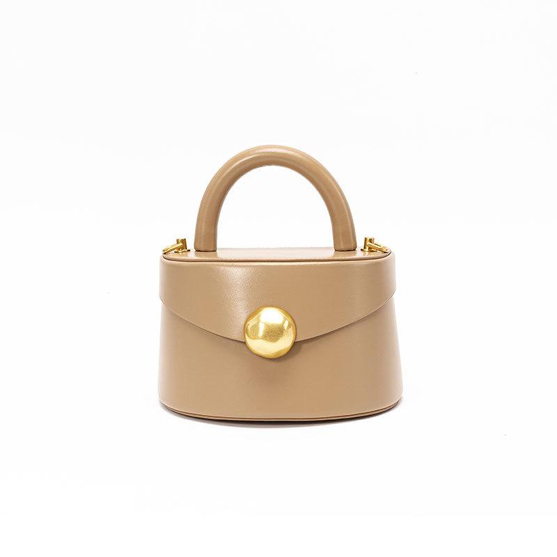 

Женская кожаная сумка, высококлассная металлическая портативная полукруглая сумка-коробка, сумка-ведро, простая трехмерная сумка через плечо.