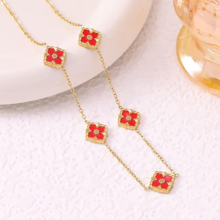 European Three-Piece Jewelry Set: Retro Black Gold Four-Leaf Clover Necklace, Earrings, and Bracelet