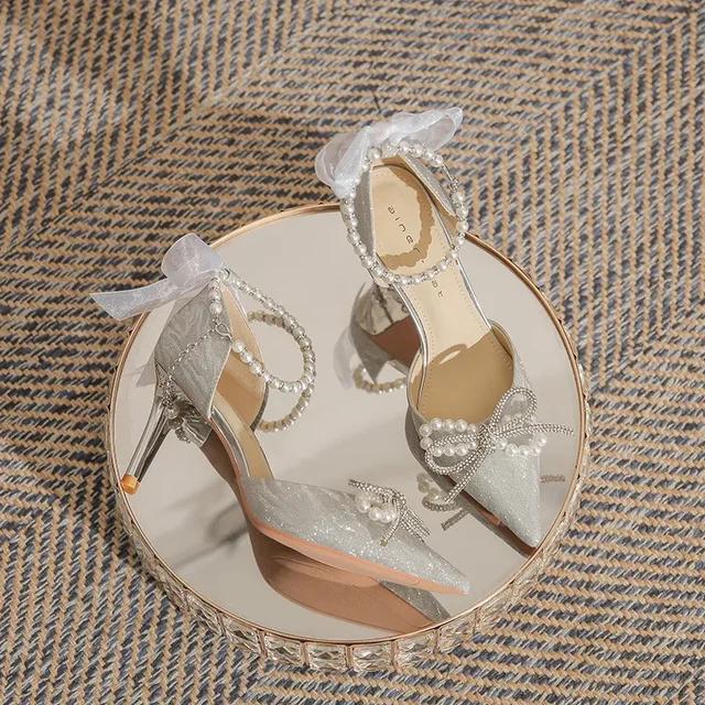 

Женские босоножки на высоком каблуке 2025 Весна/Лето Новый стиль Острый носок Бант Жемчуг Тонкий каблук Обувь Французский Кристалл Свадебная обувь 34
